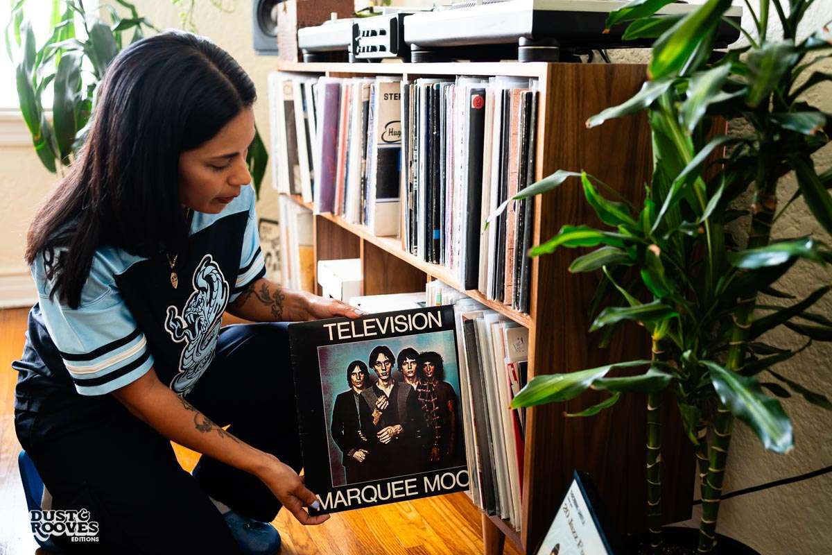 Melissa Dueñas, aka Sonrisita, a vinyl record collectors, photographed with her at her home in Los Angeles, CA for Dust & Grooves Volume 2 book.