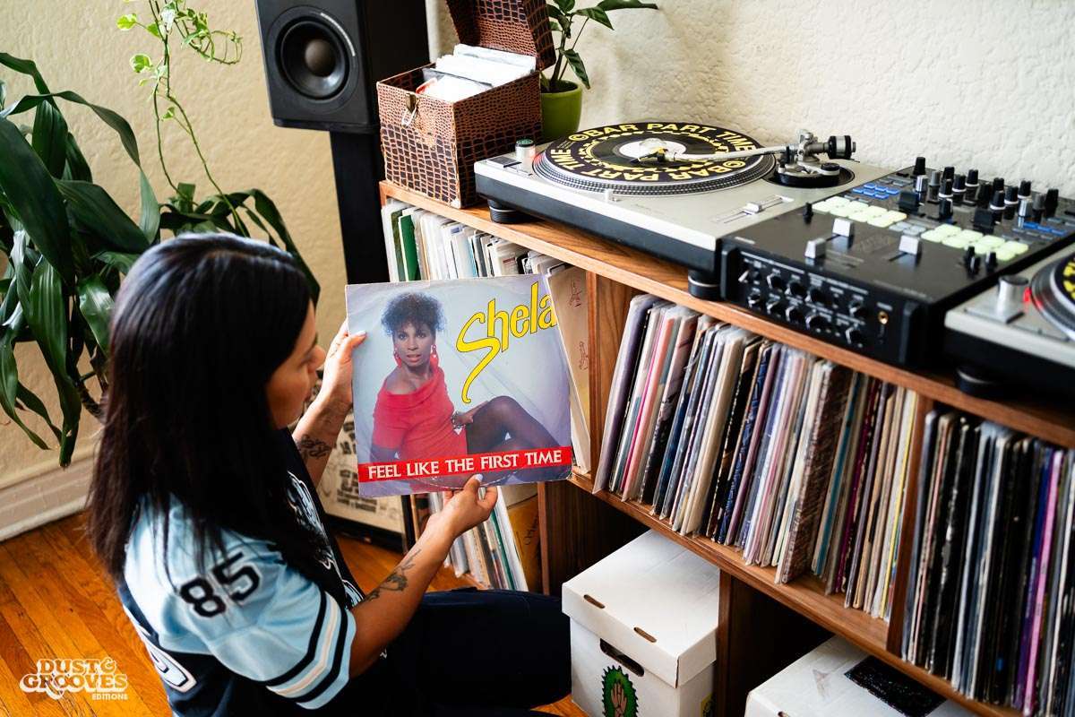 Melissa Dueñas, aka Sonrisita, a vinyl record collectors, photographed with her at her home in Los Angeles, CA for Dust & Grooves Volume 2 book.