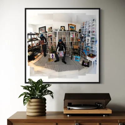 Dam-Funk standing in his Los Angeles record room surrounded by vinyl, photographed by Eilon Paz for Dust & Grooves.