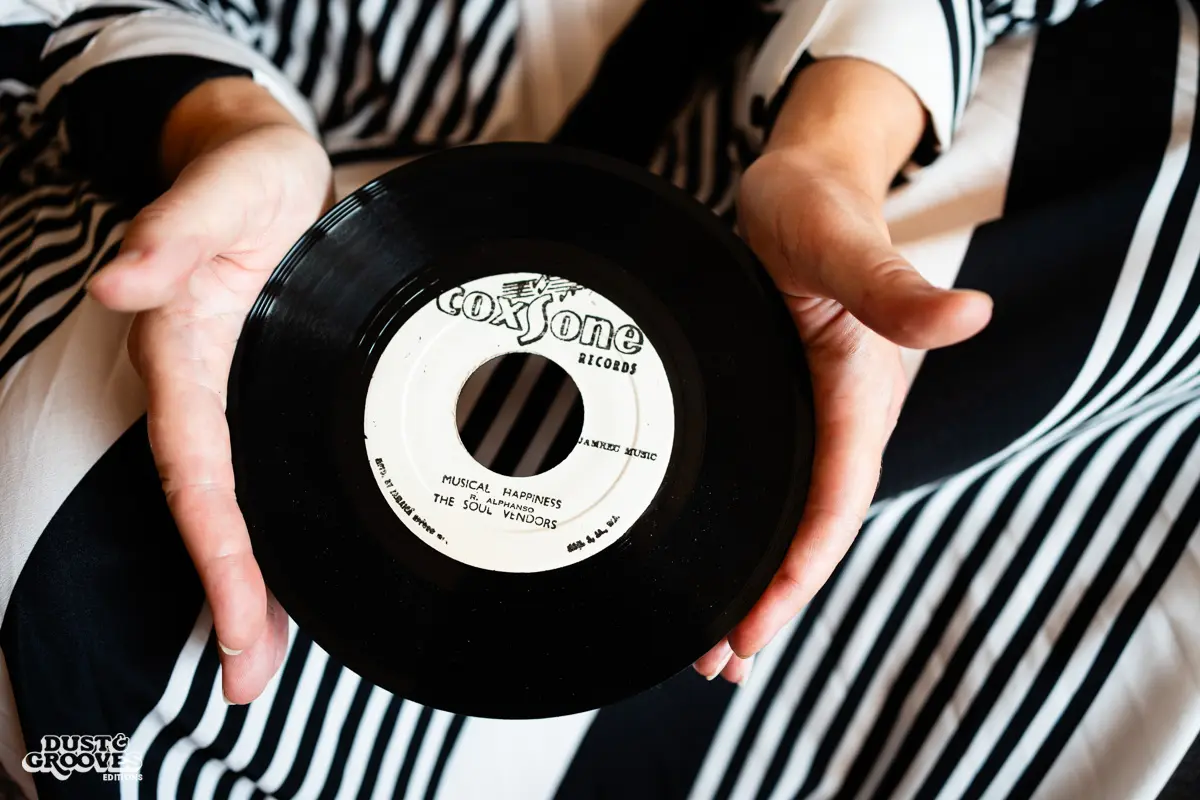 Zoë Baxter, AKA Lucky Cat Zoë, photographed at her London apartment, with her East Asian and Reggae vinyl record collection for Dust & Grooves Volume 2 book.