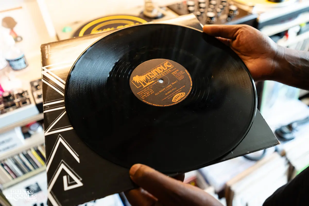 Charlie Dark, DJ, coach, and founder of Run Dem Crew, photographed at his London apartment, with his vinyl record collection for Dust & Grooves Volume 2 book.