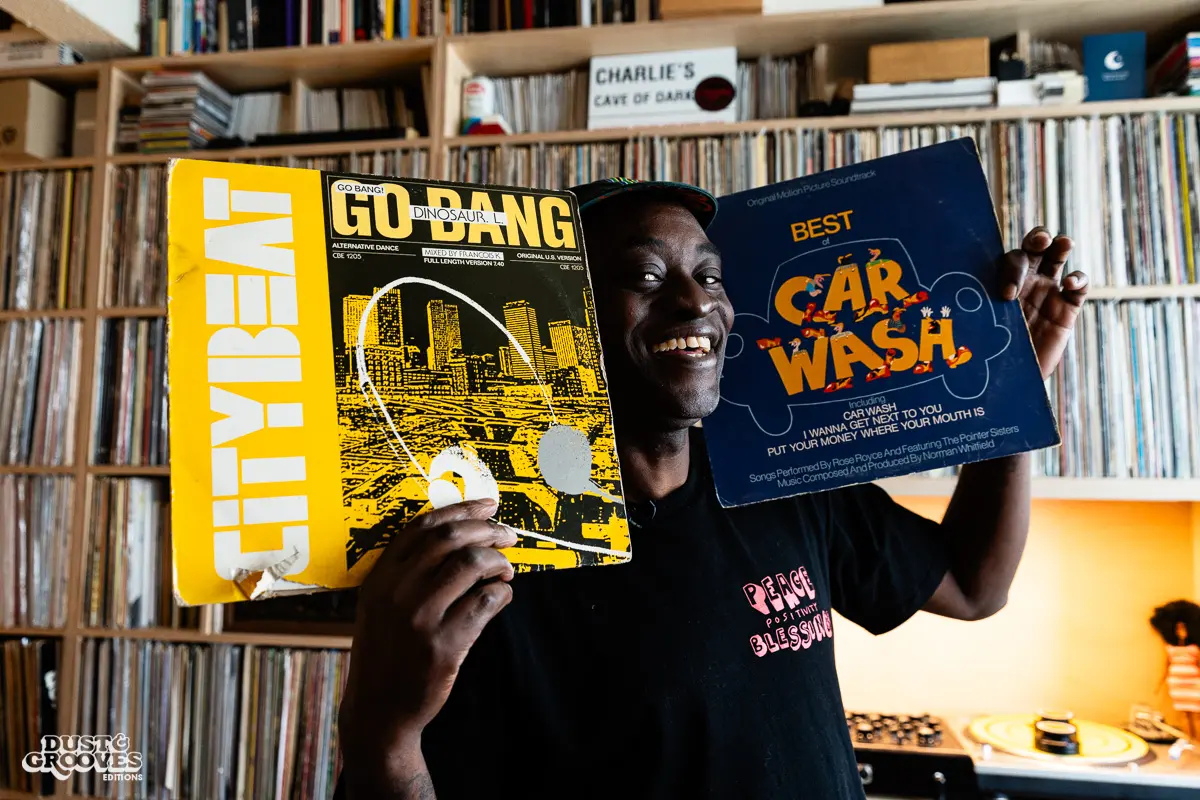 Charlie Dark, DJ, coach, and founder of Run Dem Crew, photographed at his London apartment, with his vinyl record collection for Dust & Grooves Volume 2 book.