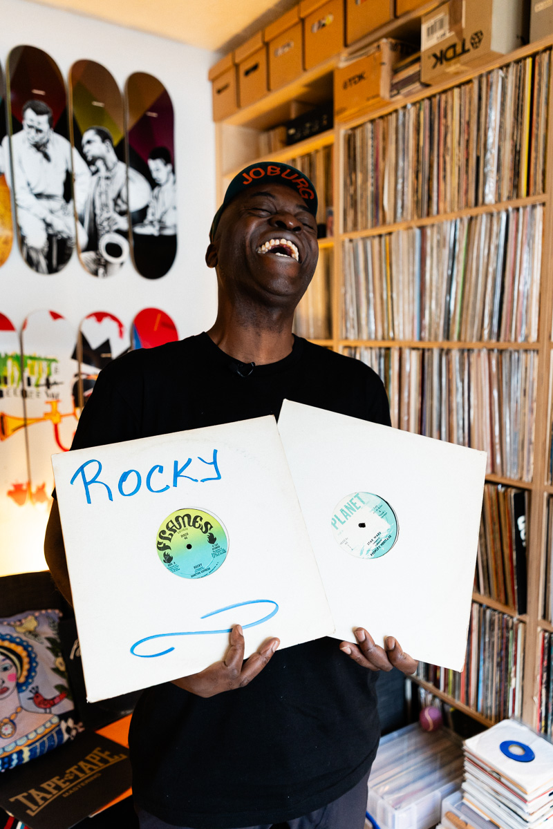 Charlie Dark, DJ, coach, and founder of Run Dem Crew, photographed at his London apartment, with his vinyl record collection for Dust & Grooves Volume 2 book.