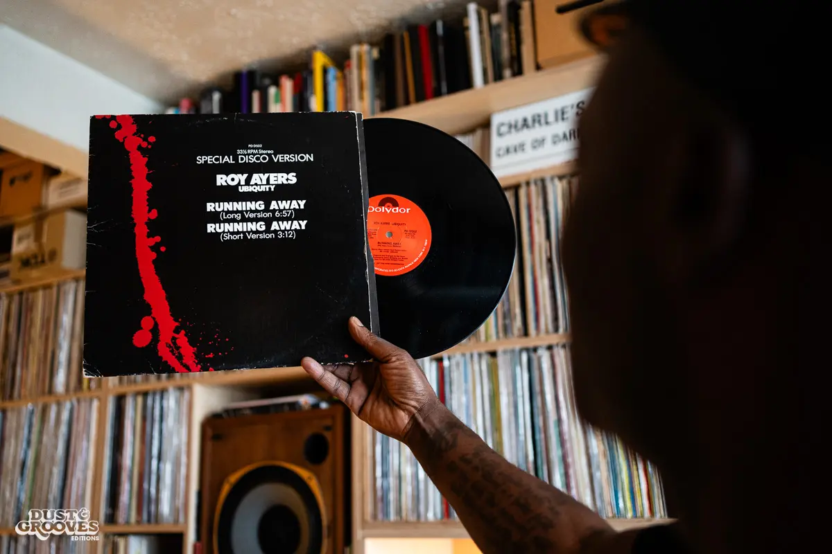 Charlie Dark, DJ, coach, and founder of Run Dem Crew, photographed at his London apartment, with his vinyl record collection for Dust & Grooves Volume 2 book.
