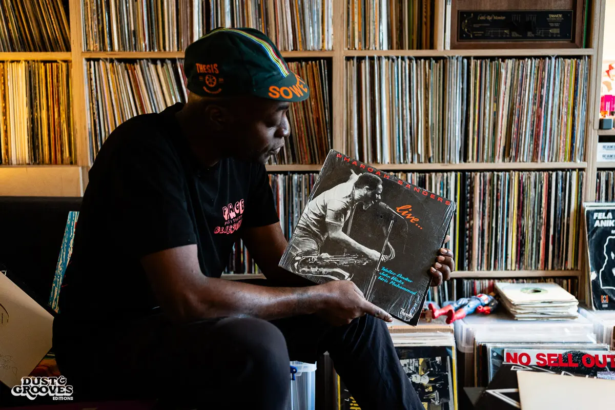 Charlie Dark, DJ, coach, and founder of Run Dem Crew, photographed at his London apartment, with his vinyl record collection for Dust & Grooves Volume 2 book.