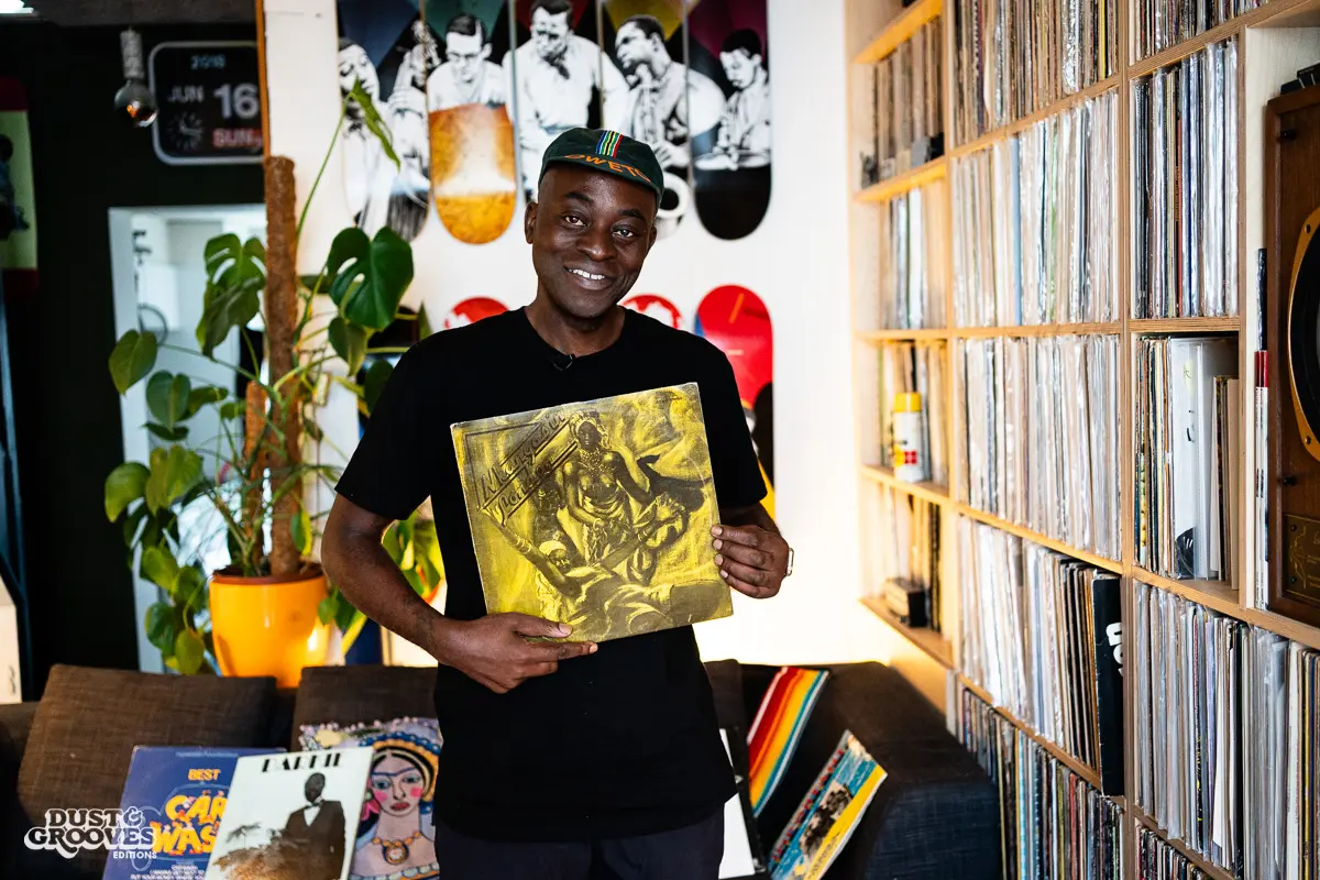 Charlie Dark, DJ, coach, and founder of Run Dem Crew, photographed at his London apartment, with his vinyl record collection for Dust & Grooves Volume 2 book.