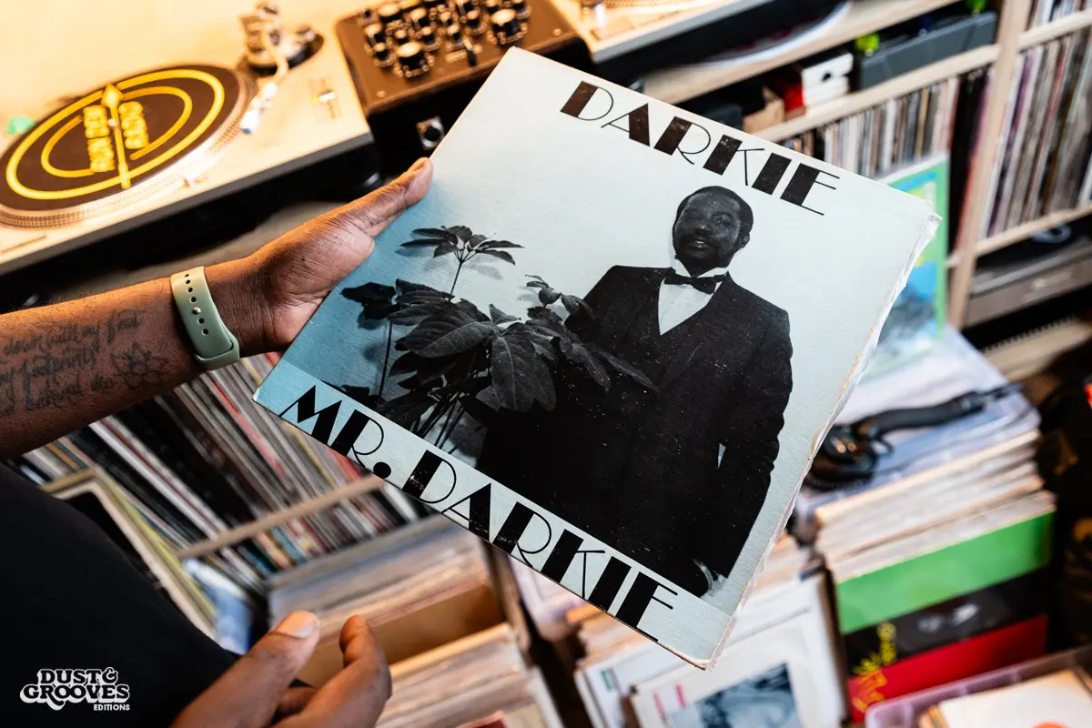 Charlie Dark, DJ, coach, and founder of Run Dem Crew, photographed at his London apartment, with his vinyl record collection for Dust & Grooves Volume 2 book.