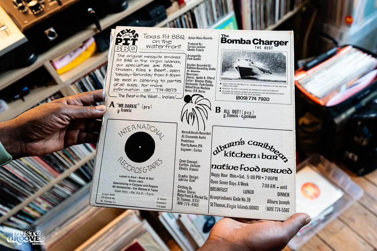 Charlie Dark, DJ, coach, and founder of Run Dem Crew, photographed at his London apartment, with his vinyl record collection for Dust & Grooves Volume 2 book.