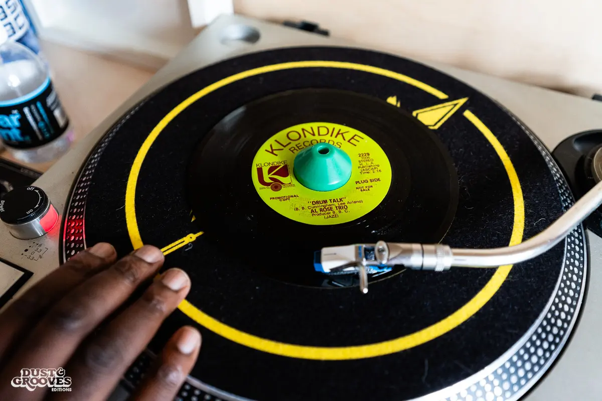 Charlie Dark, DJ, coach, and founder of Run Dem Crew, photographed at his London apartment, with his vinyl record collection for Dust & Grooves Volume 2 book.