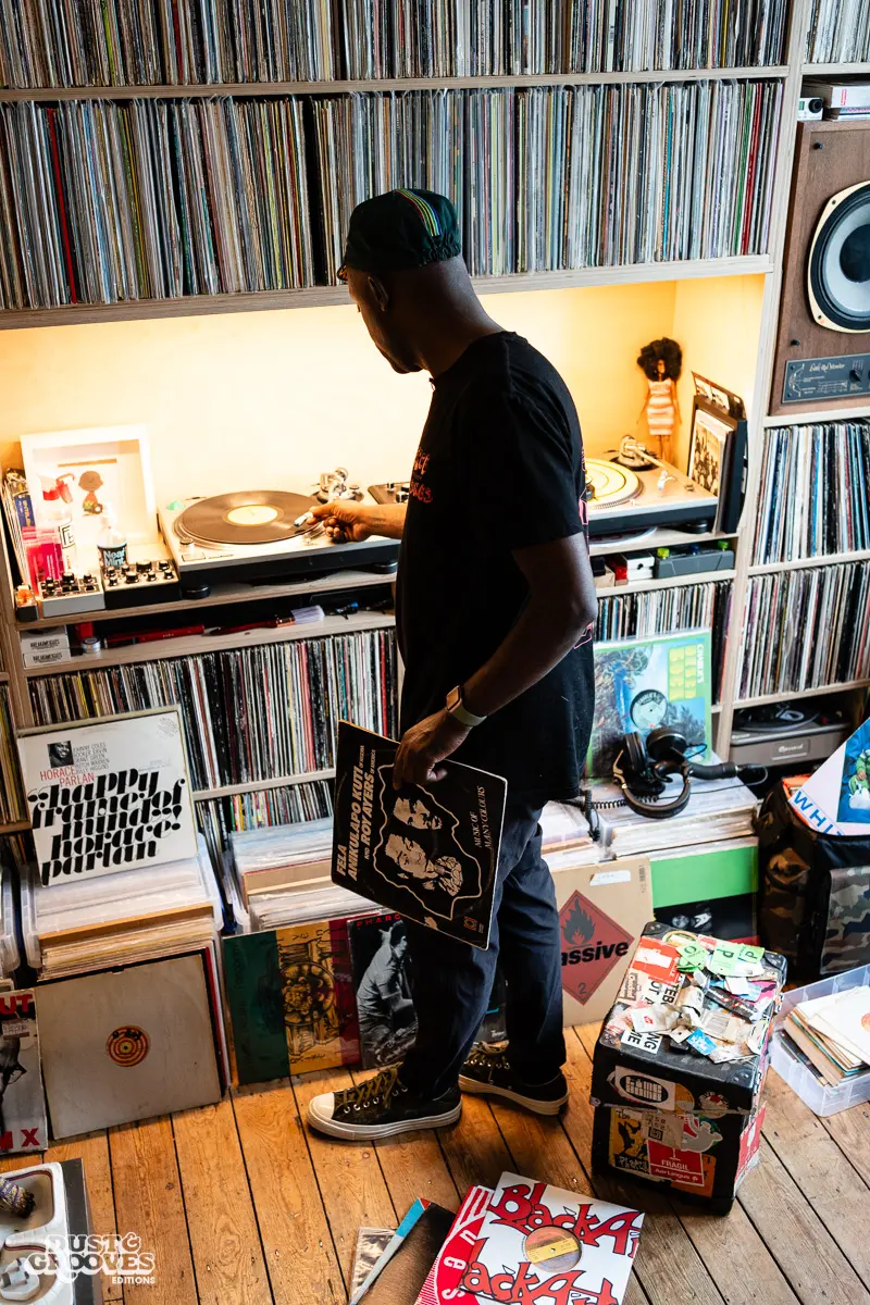 Charlie Dark, DJ, coach, and founder of Run Dem Crew, photographed at his London apartment, with his vinyl record collection for Dust & Grooves Volume 2 book.