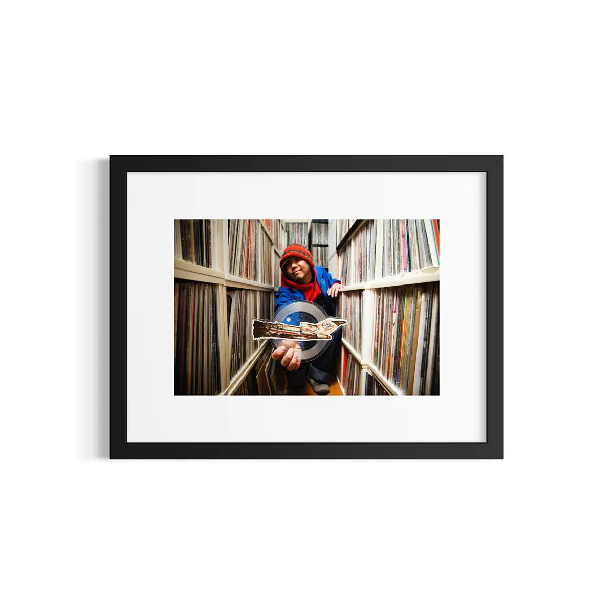 DJ Muro. Tokyo, Japan. Muro holding The Beastie Boys’ picture disc 45 single of “No Sleep ‘til Brooklyn.”