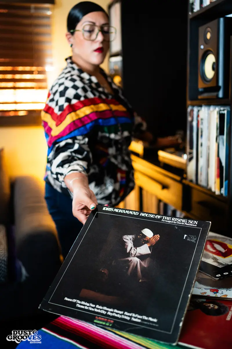 Rocio “Wyldeflower” Contreras, a Los Angeles–based DJ, record collector, and KCRW radio host, photographed at her LA home with her record collection for Dust & Grooves Volume 2.