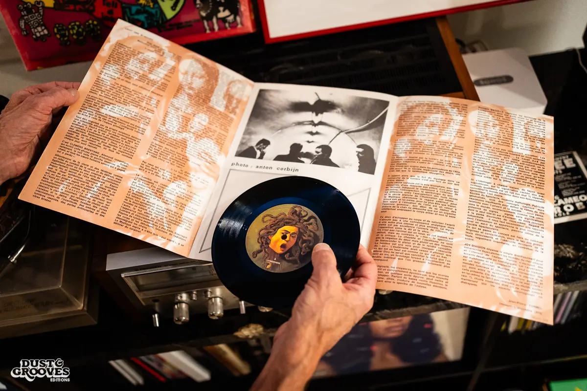 KEXP music director Kevin Cole in his home record basement in Seattle, pictured with shelves of vinyl and personal music memorabilia for Dust & Grooves Volume 2.
