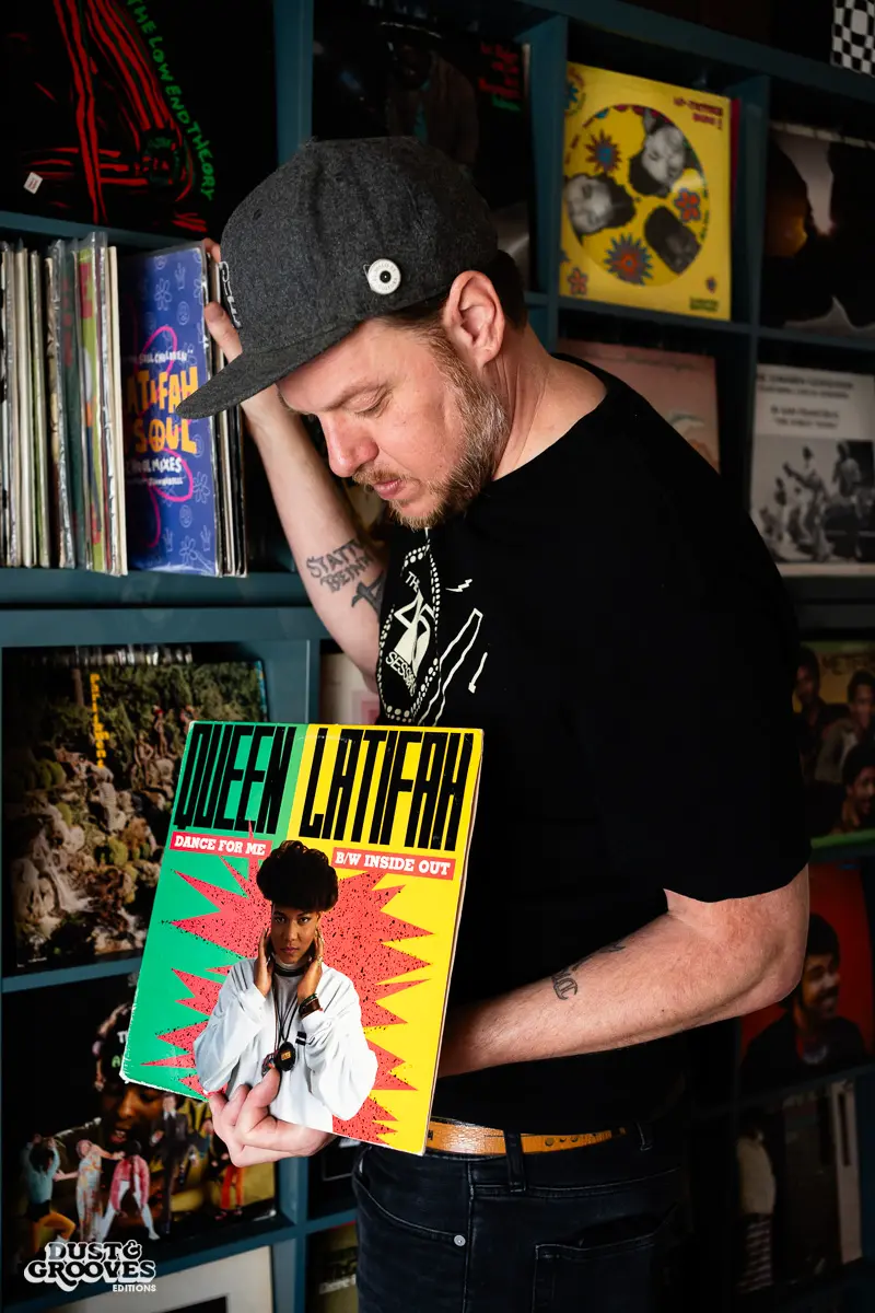 DJ Platurn, a music producer and vinyl record collector, is pictured in his Vallejo, CA home with shelves of vinyl and personal music memorabilia for Dust & Grooves Volume 2.