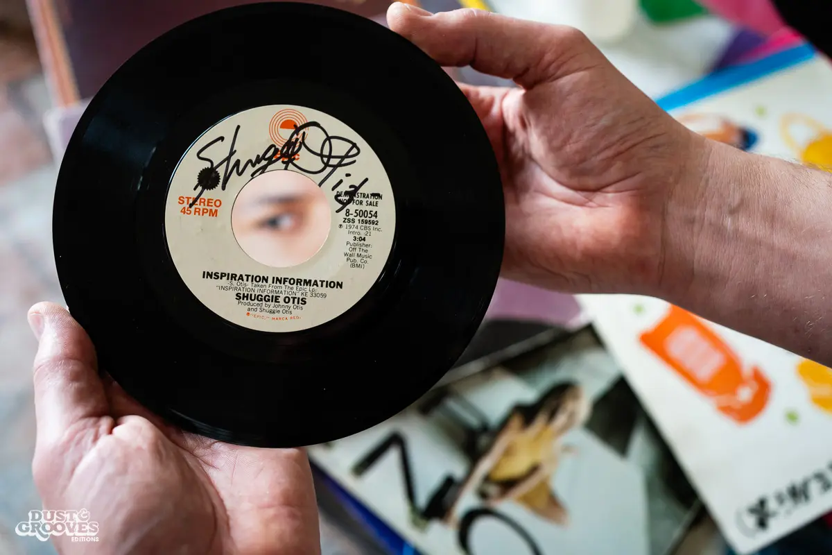 DJ Platurn, a music producer and vinyl record collector, is pictured in his Vallejo, CA home with shelves of vinyl and personal music memorabilia for Dust & Grooves Volume 2. 
