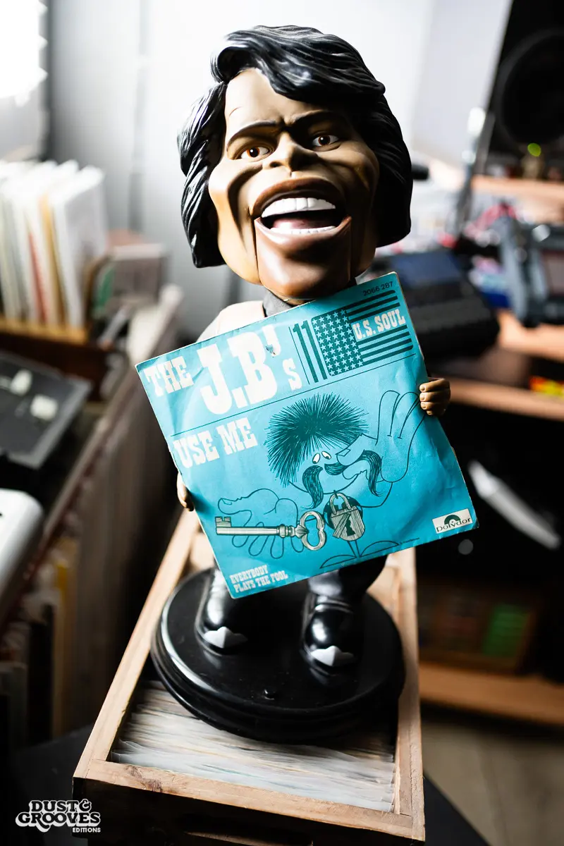 DJ Platurn, a music producer and vinyl record collector, is pictured in his Vallejo, CA home with shelves of vinyl and personal music memorabilia for Dust & Grooves Volume 2. 