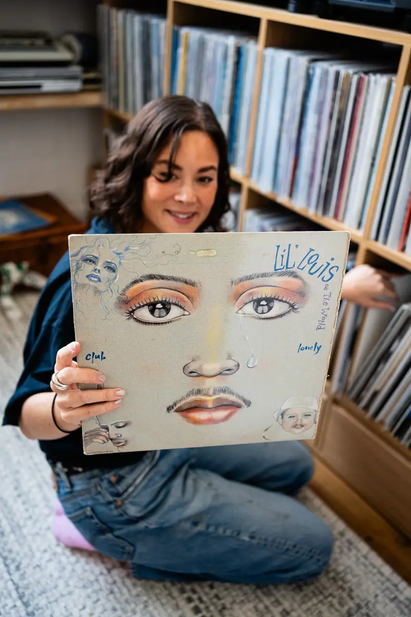 Louise Chen, DJ and vinyl record collector, is pictured at her Parisian apartment with shelves of vinyl records for Dust & Grooves Volume 2.