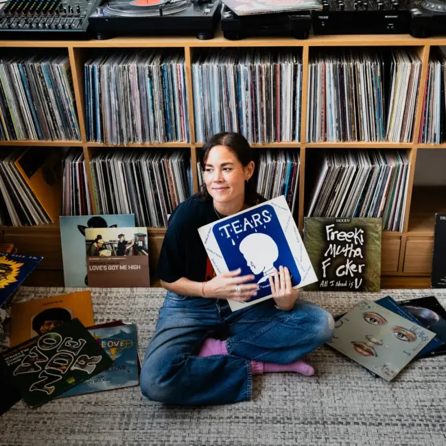 Louise Chen, DJ and vinyl record collector, is pictured at her Parisian apartment with shelves of vinyl records for Dust & Grooves Volume 2.