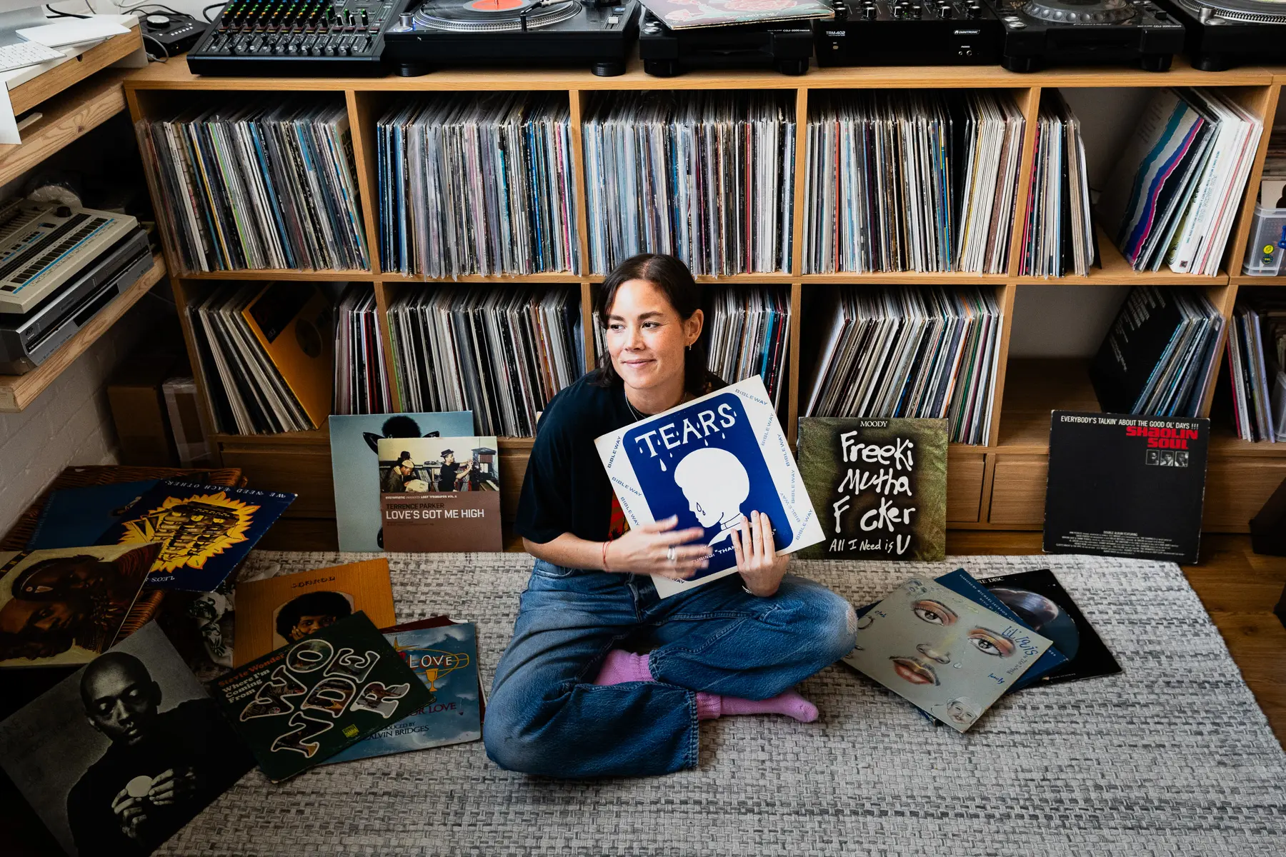 Louise Chen, DJ and vinyl record collector, is pictured at her Parisian apartment with shelves of vinyl records for Dust & Grooves Volume 2.