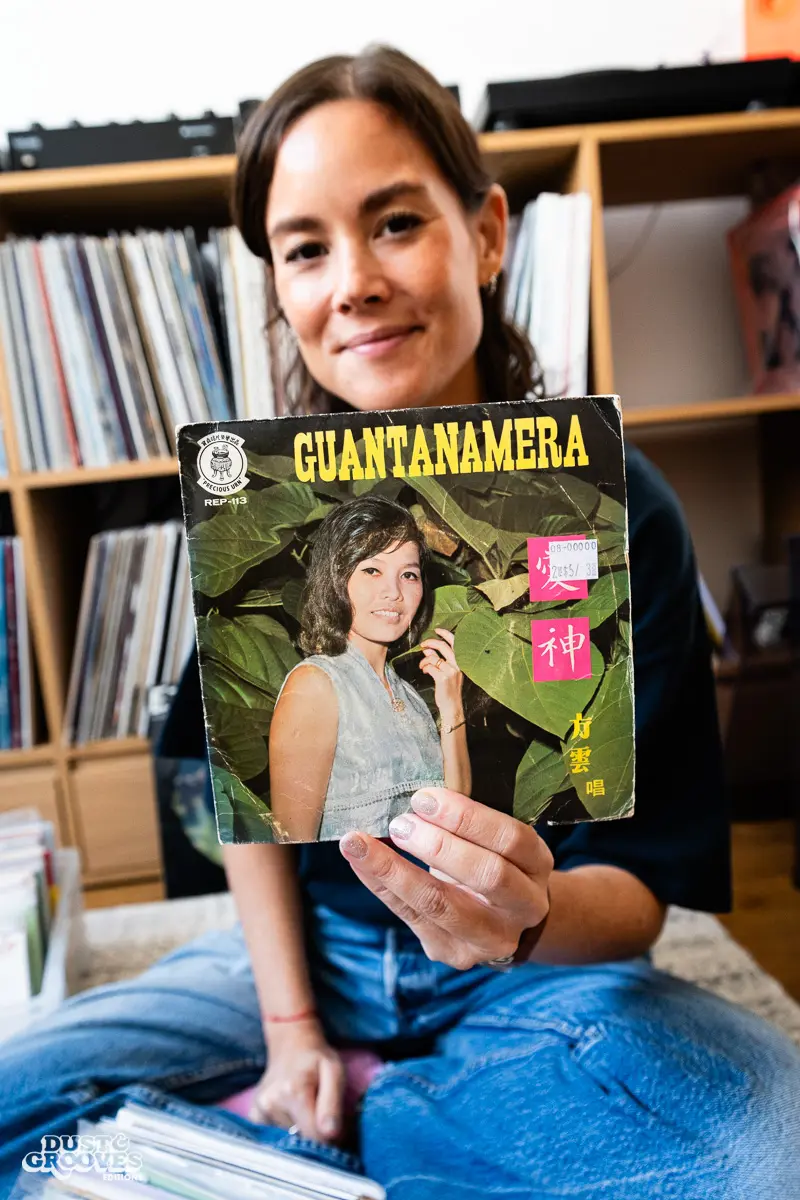 Louise Chen, DJ and vinyl record collector, is pictured at her Parisian apartment with shelves of vinyl records for Dust & Grooves Volume 2.