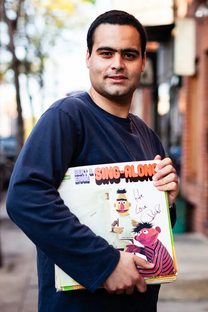 Dante Candelora, a vinyl record collector, is pictured in South Philadelphia with his collection of Sesame Street records, including Big Bird and Bert albums, photographed for Dust & Grooves Vol. 1.