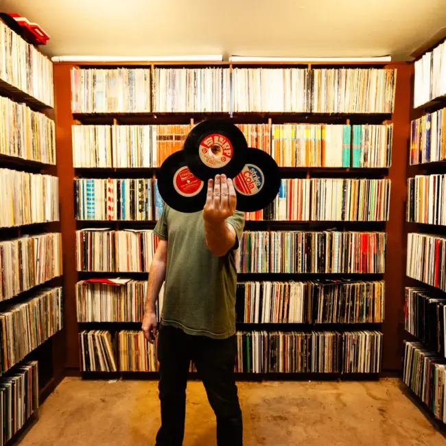 Cut Chemist, AKA Lucas McFadden, Music producer, recording artist and a vinyl record collector, is pictured in home studio in Los Angeles with his collection, photographed for Dust & Grooves Vol. 1.