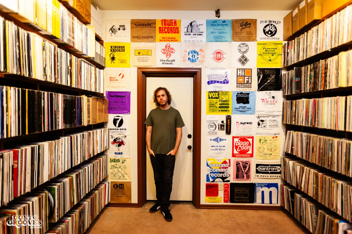 Cut Chemist, aka Lucas McFadden, music producer, recording artist, and vinyl record collector, is pictured in his home studio in Los Angeles with his collection, photographed for Dust & Grooves Vol. 1.